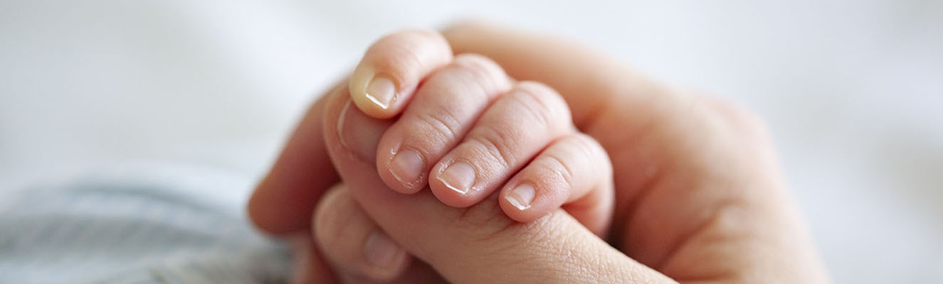Baby holding hand